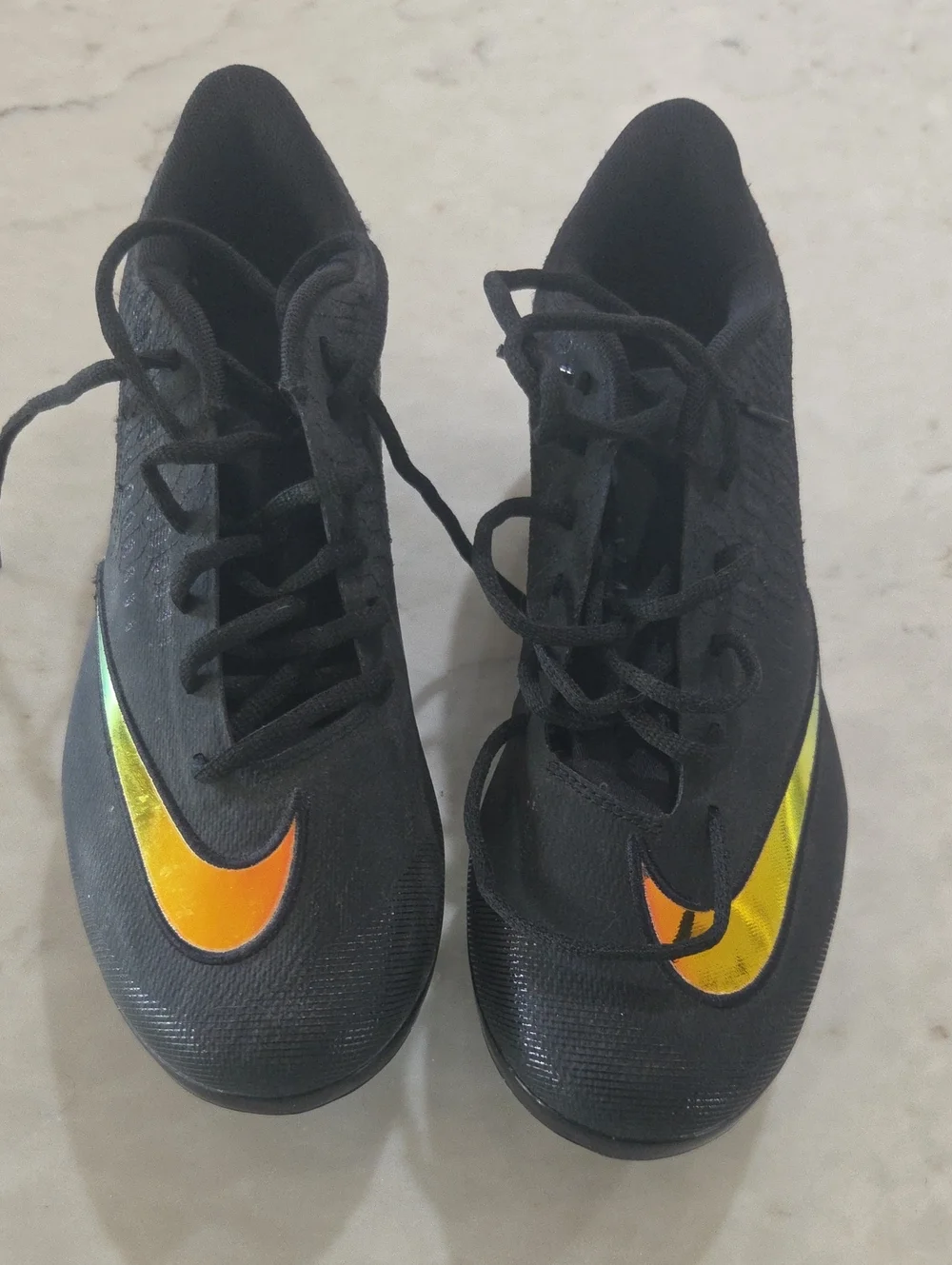 Nike Kids Black Sneakers with Orange-Yellow Swoosh